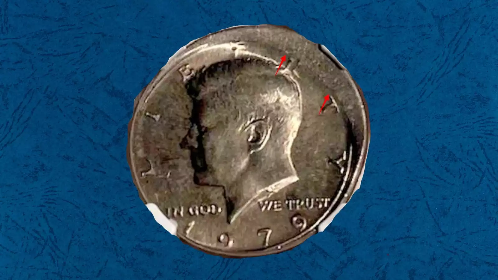 1979 Kennedy half dollar off-center strike error showing partial design shifted from center of the planchet