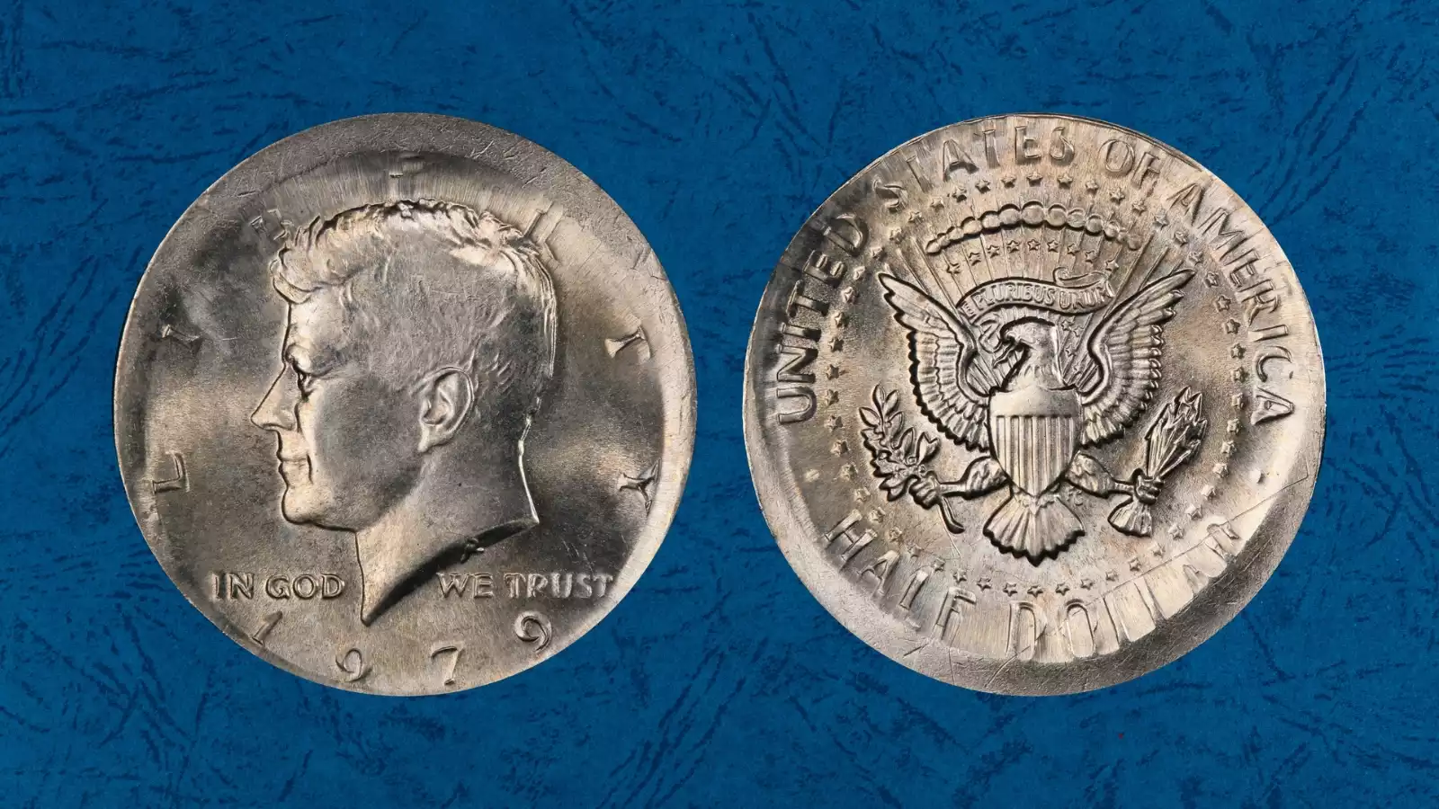 1979 Kennedy half dollar broadstrike error showing expanded planchet and missing collar with spread design